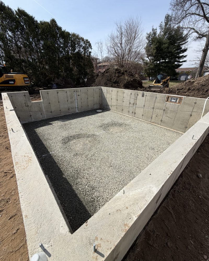 Foundation excavation for residential ADU construction basement floor prep